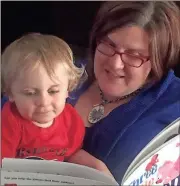  ??  ?? Michelle Meyer and her son Hollis are one of many in Polk who benefit from books.