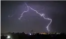  ?? Photograph: Guillermo Munoz/AFP/Getty Images ?? A lightning bolt strikes over a popular neighbourh­ood of Bogota in 2022. The new discovery paves the way for laser-based lightning protection systems at airports, launchpads and tall buildings.