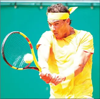  ??  ?? Spain’s Rafael Nadal returns the ball to Bulgaria’s Gregor Dimitrov during their semifinal singles match of the
Monte Carlo Tennis Masters tournament in Monaco, on April 21. (AP)