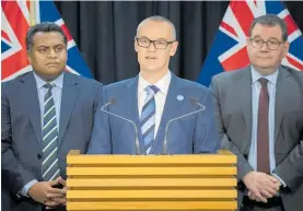  ?? Photo / Mark Mitchell ?? David Clark (centre) has resigned as Health Minister.