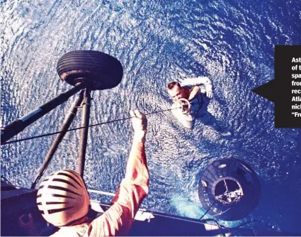  ??  ?? Astronaut Alan B. Shepard Jr., pilot of the Mercury-Redstone 3 suborbital spacefligh­t, is retrieved by a helicopter from the USS Lake Champlain during recovery operations in the western Atlantic Ocean May 5, 1961. Shepard nicknamed the the Mercury spacecraft “Freedom 7.”