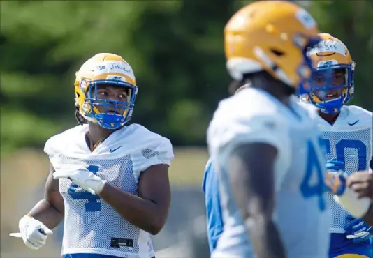  ?? Pam Panchak/Post-Gazette ?? PItt defensive lineman Nahki Johnson goes through a drill on the first day of preseason camp Friday.