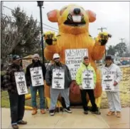  ?? DIGITAL FIRST MEDIA FILE PHOTO ?? Members of Laborer’s Local 135, from left, R. Brown, Kevan Glasper, Kevin Lahr, Kevin McIntosh and Vernon Woodall, pose in front of an inflatable rat as they picket Westrum Developmen­t Co. for allegedly destroying community wages and standards by not...