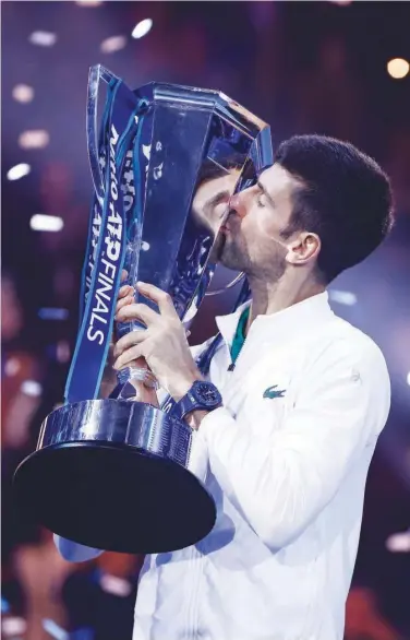  ?? Reuters ?? Novak Djokovic kisses the trophy after winning the ATP Finals against Norway’s Casper Ruud in Turin.