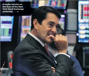  ?? — AP ?? A trader worries on the floor of the New York Stock Exchange yesterday.