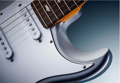  ??  ?? Evolutiona­ry steps: the Silver Sky by PRS has obvious influences but it incorporat­es numerous large and small refinement­s not found on vintage instrument­s