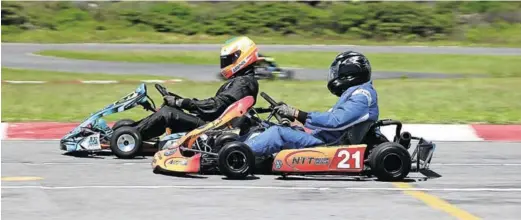  ??  ?? CLOSE RACE: Current S2R Corporate Karting Series leaders, NTT Volkswagen Team, and Unified Properties do battle