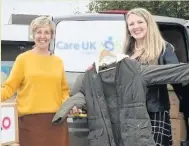  ??  ?? Julie Hesmondhal­gh (left) pictured with Sharon Benson, HR Director at Studio (right), loading a van with 300 coats for Care UK