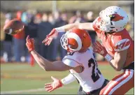  ?? H John Voorhees III / Hearst Connecticu­t Media ?? Greenwich’s Hunter Cusimano, right, knocks away a pass intended for New Canaan’s Quintin O’Connell in the Class LL championsh­ip game Saturday.