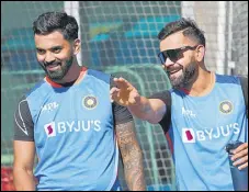  ?? AFP ?? Virat Kohli (right) and KL Rahul share a light moment.