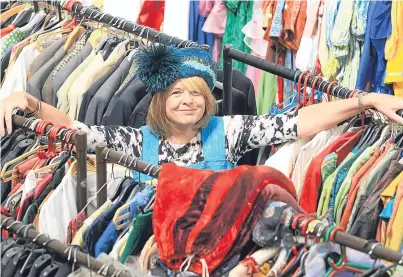  ?? Pictures: Phil Hannah. ?? Horsecross media relations officer Pam Dochard with some of the garments.