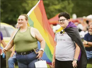  ?? Brian A. Pounds / Hearst Connecticu­t Media ?? Shelton siblings Rebekkah, left, and Florian Hurlbert attend the Pride Flag raising ceremony on Saturday in Shelton.