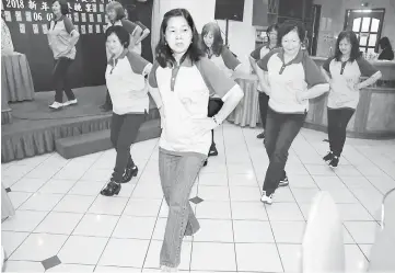  ??  ?? Members of the Tai Chi Qigong group from Seria, Brunei perform a Tai Chi Qigong healthy dance.