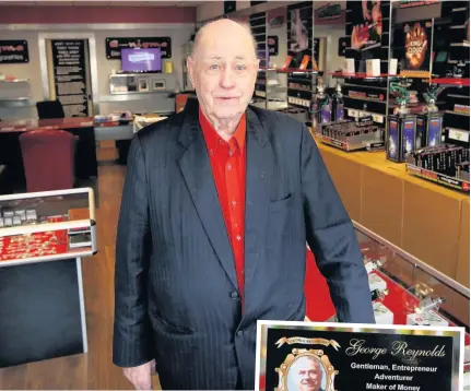  ??  ?? George Reynolds in his County Durham e-cigarette shop and, inset, his business card