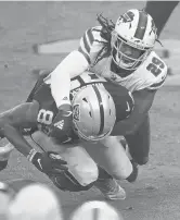  ?? ISAAC BREKKEN/AP ?? Bills cornerback Josh Norman (29) forces a fumble by Raiders tight end Darren Waller during a game on Oct. 4 in Las Vegas.