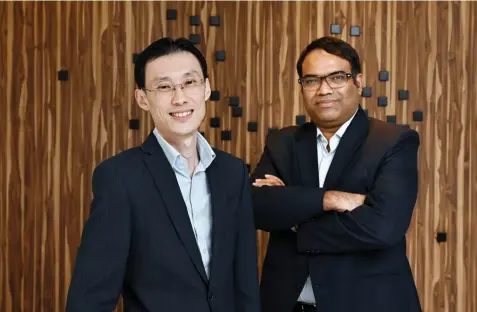  ?? ALBERT CHUA/THE EDGE SINGAPORE ?? Dr Bernard Ng and Dr Vas Metupalle, 5Digital’s executive director and chief medical officer, respective­ly