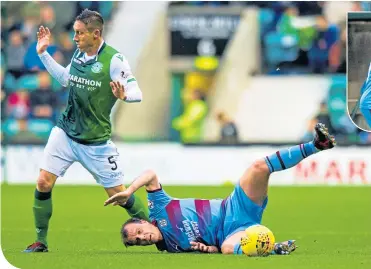  ??  ?? Dundee’s Paul McGowan takes a tumble in front of Hibernian’s Mark Milligan