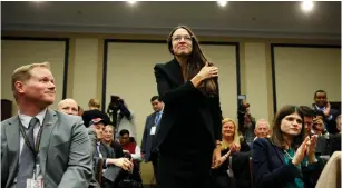  ?? (Joshua Roberts/Reuters) ?? ALEXANDRIA OCASIO-CORTEZ crosses herself during a lottery for office assignment­s on Capitol Hill last month.