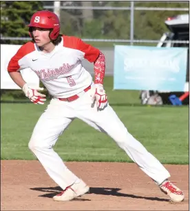  ?? ?? Whippet pinch runner Josh Sickmiller takes a lead off of second base during Monday’s clash with Lucas. (Photo by Chuck Ridenour)