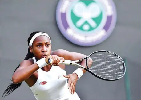  ?? BEN STANSALL/AFP ?? US player Cori Gauff returns the ball to compatriot Venus Williams during their women’s singles first round match on the first day of the 2019 Wimbledon Championsh­ips at The All England Lawn Tennis Club in Wimbledon, southwest London, on Monday.