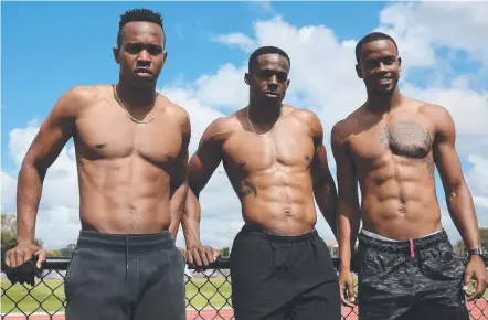  ?? Picture: GETTY IMAGES/GOLDOC ?? Julian Forte, Ronald Levy and Jonathan Farinha get their tops off at Runaway Bay.