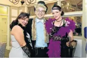  ?? Picture: EUGENE COETZEE ?? JAZZ-STYLE: Hermoine Kemp, left, Charles Jeffrey and Chantelle Reeder dressed up for the farewell party for De Vos Malan school teacher Julia Kemp at the Beach Hotel on Tuesday