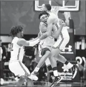  ?? Gary Coronado Los Angeles Times ?? SIERRA CANYON’S Ziaire Williams, center, is hugged after making winning shot against Etiwanda.