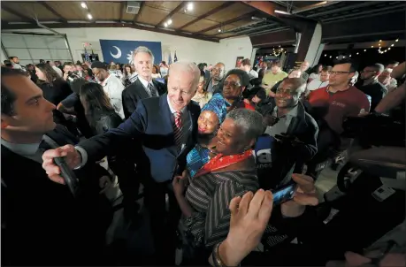  ?? GERALD HERBERT — THE ASSOCIATED PRESS ?? Democratic presidenti­al candidate, former Vice President Joe Biden, takes photos after speaking at a campaign event Tuesday in Columbia, S.C.