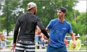  ?? THOMAS NASH — DIGITAL FIRST MEDIA ?? Teammates Kameron Beans, left, of Annapolis MD, and Garrett Dimm, of Lancaster, celebrate after picking up a point during the Pottstown Rumble.