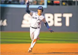  ?? ANDREW LAHODYNSKY­J/ASSOCIATED PRESS FILE PHOTO ?? Matt Chapman celebrates his walkoff double against the Red Sox during a September game as a member of the Toronto Blue Jays. Chapman and the San Francisco Giants agreed to a $54 million, three-year contract Sunday.