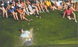  ?? The Associated Press ?? CLEARING THE BUNKER: Jordan Spieth hits from the greenside bunker on the 15th hole during the third round of the Travelers Championsh­ip Saturday in Cromwell, Conn.