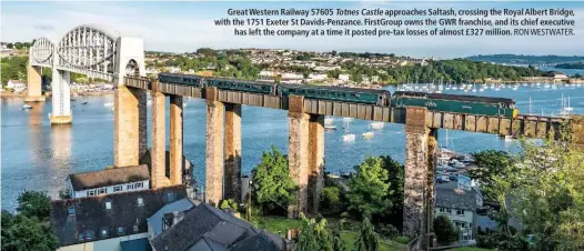  ?? RON WESTWATER. ?? Great Western Railway 57605 Totnes Castle approaches Saltash, crossing the Royal Albert Bridge, with the 1751 Exeter St Davids-Penzance. FirstGroup owns the GWR franchise, and its chief executive has left the company at a time it posted pre-tax losses...