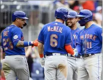  ?? NICK WASS - THE ASSOCIATED PRESS ?? New York Mets’ Kevin Pillar (11) celebrates his grand slam with Jeff McNeil (6), Javier Baez (23) and Michael Conforto, third from left, during the ninth inning of a baseball game against the Washington Nationals, Sunday, Sept. 5, 2021, in Washington.