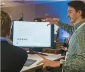  ?? STEPHEN BRASHEAR/AP ?? Microsoft employee Alexander Campbell demonstrat­es the integratio­n of the Bing search engine and Edge browser with OpenAI on Feb. 7 in Redmond, Wash.