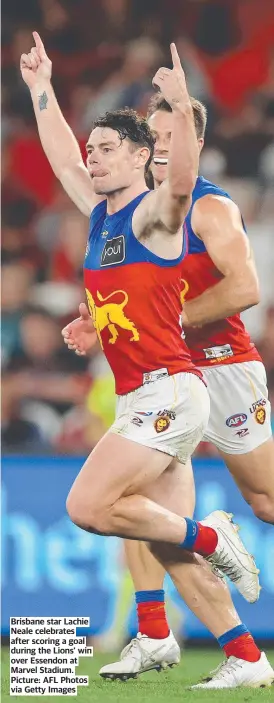  ?? Picture: AFL Photos via Getty Images ?? Brisbane star Lachie Neale celebrates after scoring a goal during the Lions’ win over Essendon at Marvel Stadium.