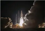  ?? AP/JM GUILLON ?? A rocket carrying an unmanned spacecraft lifts off Saturday from Kourou, French Guiana, on a mission conducted by the European and Japanese space agencies.