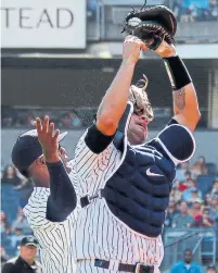  ?? ADAM HUNGER THE ASSOCIATED PRESS ?? Yankees catcher Gary Sanchez snagged a foul popup in the fourth, levelling Miguel Andujar in the process.