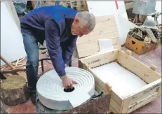  ??  ?? One of 14 sculptures for an exhibition called Ritual Geometries is packed into a crate.