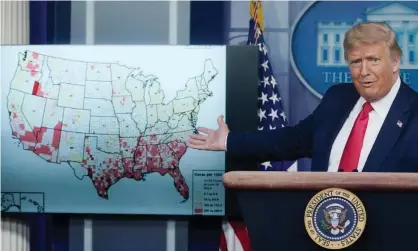  ?? Photograph: Drew Angerer/Getty Images ?? Donald Trump gestures to a map while speaking about his administra­tion’s response to the coronaviru­s pandemic.