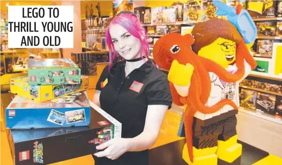  ?? Picture: Shae Beplate ?? Brick specialist Tiffany Hone inside the new LEGO store at Stockland shopping centre.
