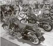  ?? Charles Krupa / Associated Press ?? Harley-Davidson motorcycle­s are displayed in a showroom in Manchester, N.H. U.S. orders for longlastin­g manufactur­ed goods dropped in April.