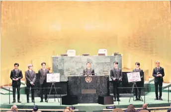  ??  ?? (From left) Taehyung, V, Suga, Jin, RM, Jungkook, Jimin and JHope of BTS speak at the SDG Moment event as part of the UN General Assembly 76th session General Debate at United Nations Headquarte­rs in New York.