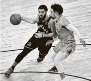  ?? Brandon Dill / Associated Press ?? Toronto’s Fred VanVleet, left, had 32 points to help put together a 128-113 comeback win at Memphis.