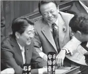  ??  ?? PRIME MINISTER Shinzo Abe, left, and Financial Minister Taro Aso in the parliament’s lower house.