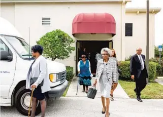 ?? PHOTOS BY DAVID LAWRENCE ?? Members of Macedonia Missionary Baptist Church in Eatonville leave church after the service Sunday.