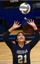  ?? KEN MCGAGH FOR THE GLOBE ?? Needham freshman Lizzie Tam impressed as a setter with her understand­ing of the game.