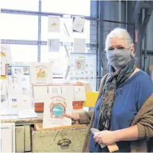  ?? NOUSHIN ZIAFATI • SALTWIRE NETWORK ?? Jane Mason-Browne at the Halifax Seaport Farmers' Market on Sunday. The illustrato­r runs the Peachtree and Finch Graphic Design booth and is excited about the market's relocation.