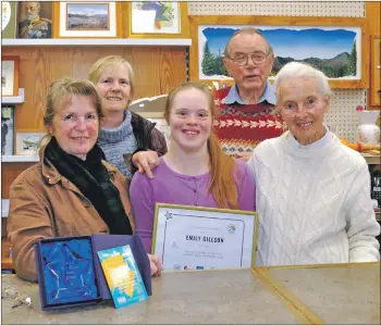  ??  ?? Emily with her award at the ArCaS shop with volunteers left to right: June McLean, Linda Taylor and Alan and Ruth Thompson. 01_B43arcas01