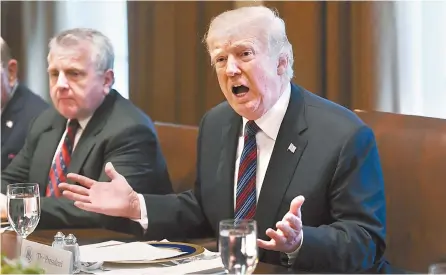  ?? AFP-Yonhap ?? U.S. President Donald Trump hosts a working lunch with the Baltic heads of state in the Cabinet Room of the White House in Washington, D.C., Tuesday. China vowed to take measures of the “same strength” in response to a proposed U.S. tariff hike on $50...