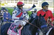  ?? BRYNN ANDERSON/ASSOCIATED PRESS ?? Jockey John Velazquez onboard Medina Spirit gives a thumbs up after winning the 147th running of the Kentucky Derby at Churchill Downs, May 1 in Louisville, Kentucky.